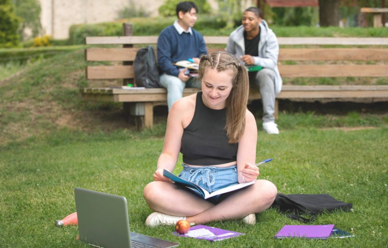 Modern workspace showing various devices running budgeting software